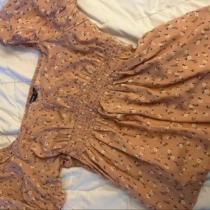 Pink floral flowy crop top, waist detailing is stretchy.